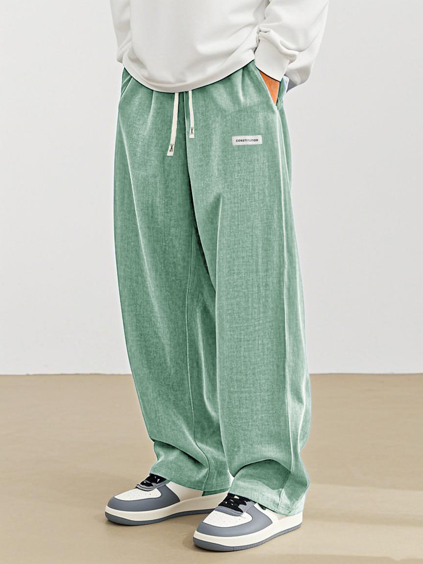 Men's Fashion Casual Everyday Hemp Fabric Pocket Embroidered Logo Loose Trousers 